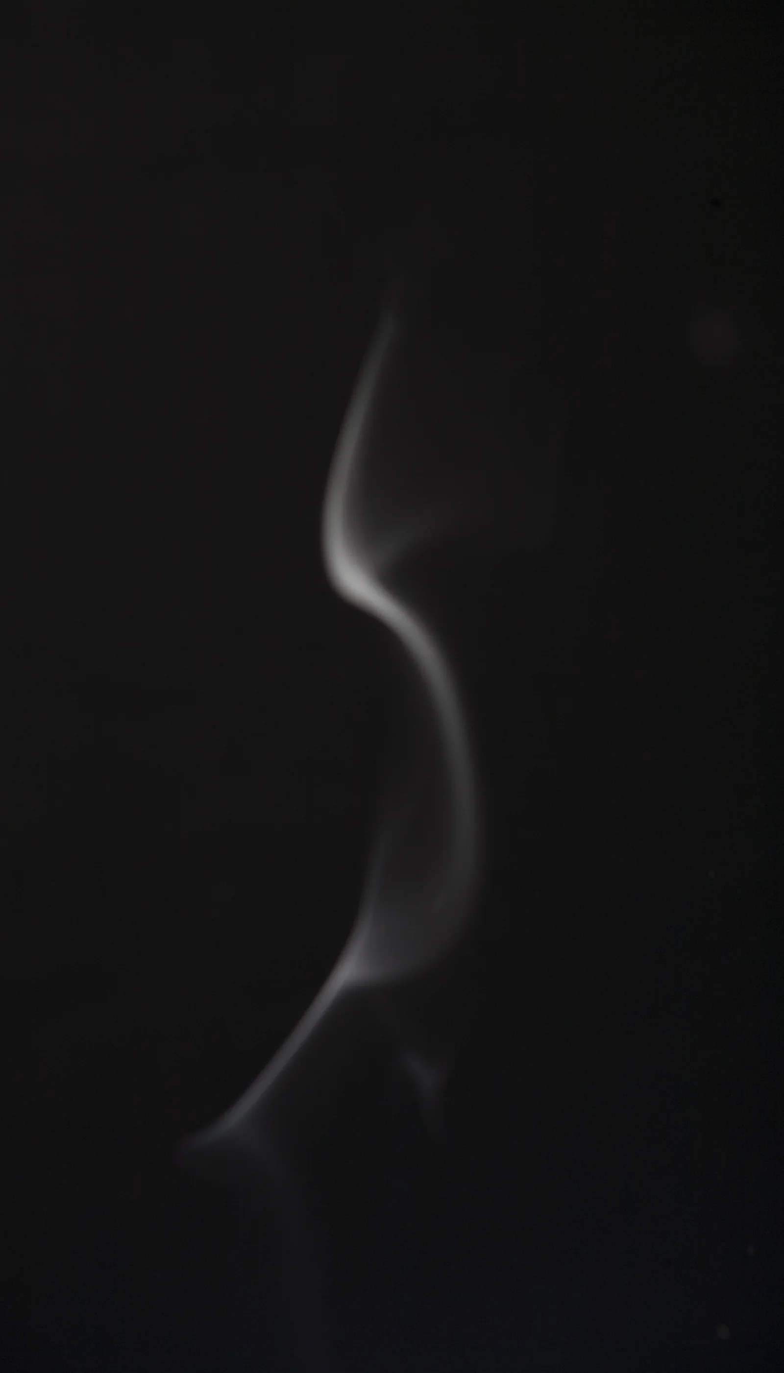 A human body dissolves into light, movement and surrounding air.