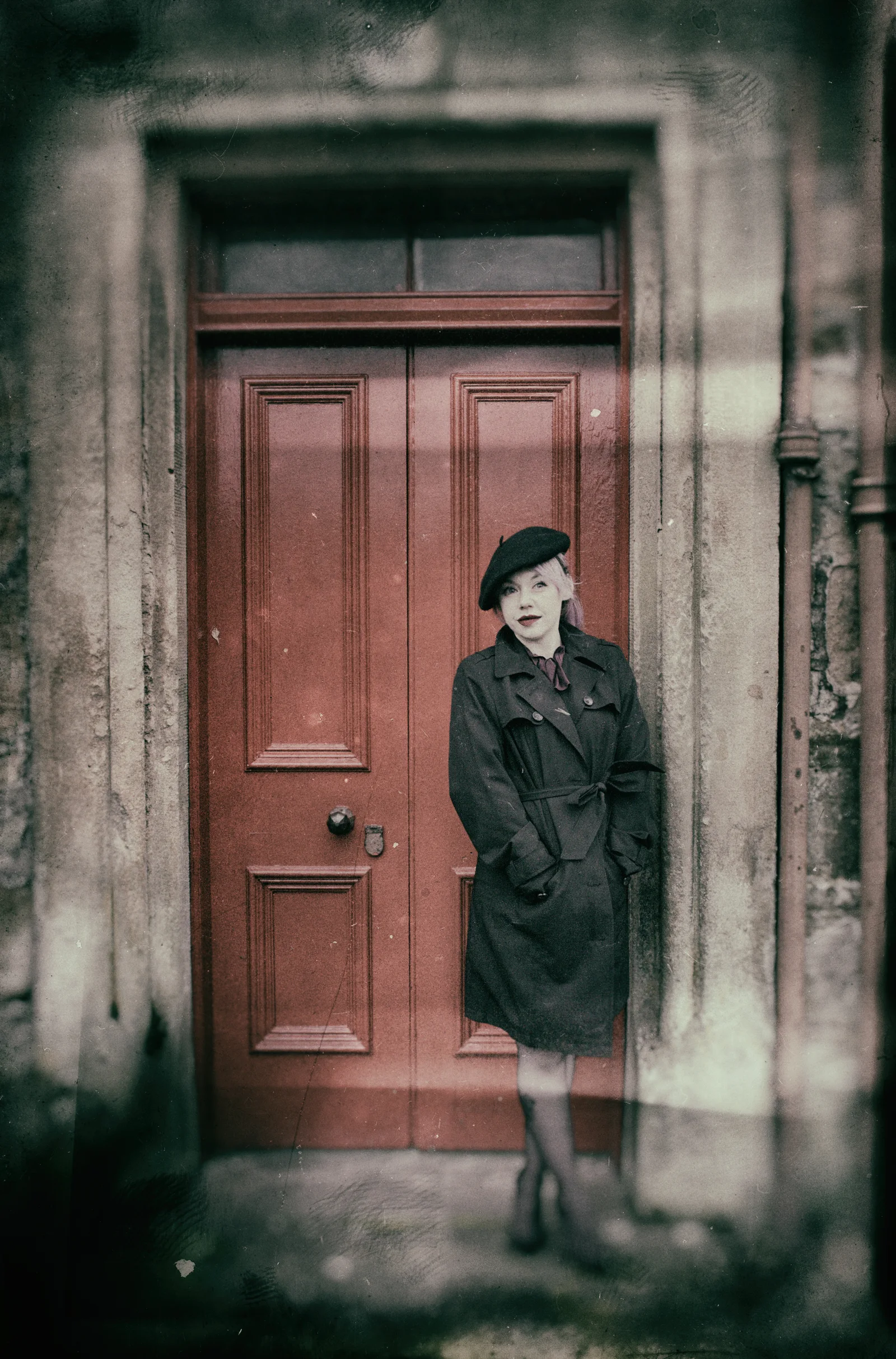 A closed door remains fixed within a dark architectural setting.