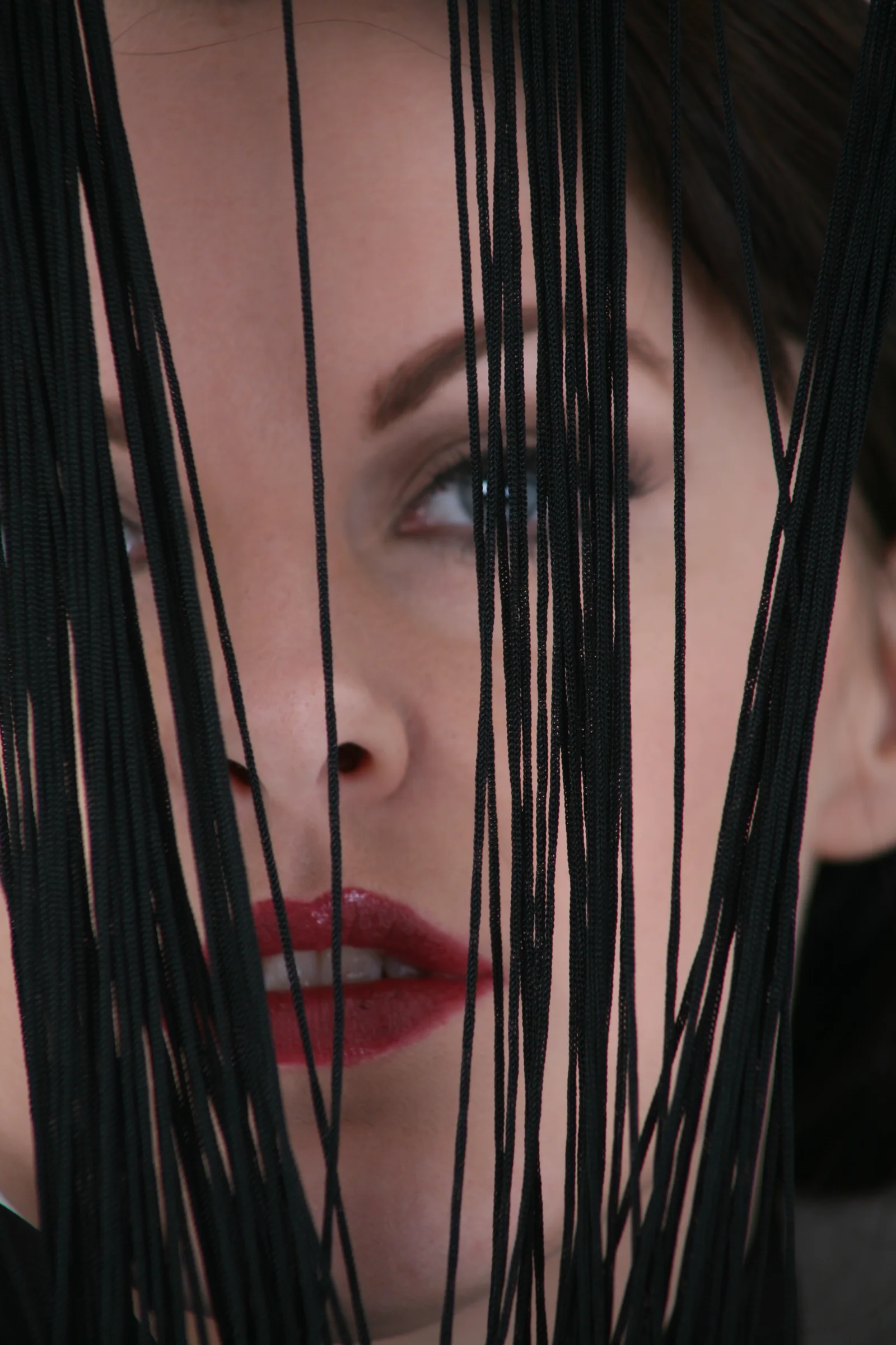 A veiled scene resolves slowly through translucent layers.