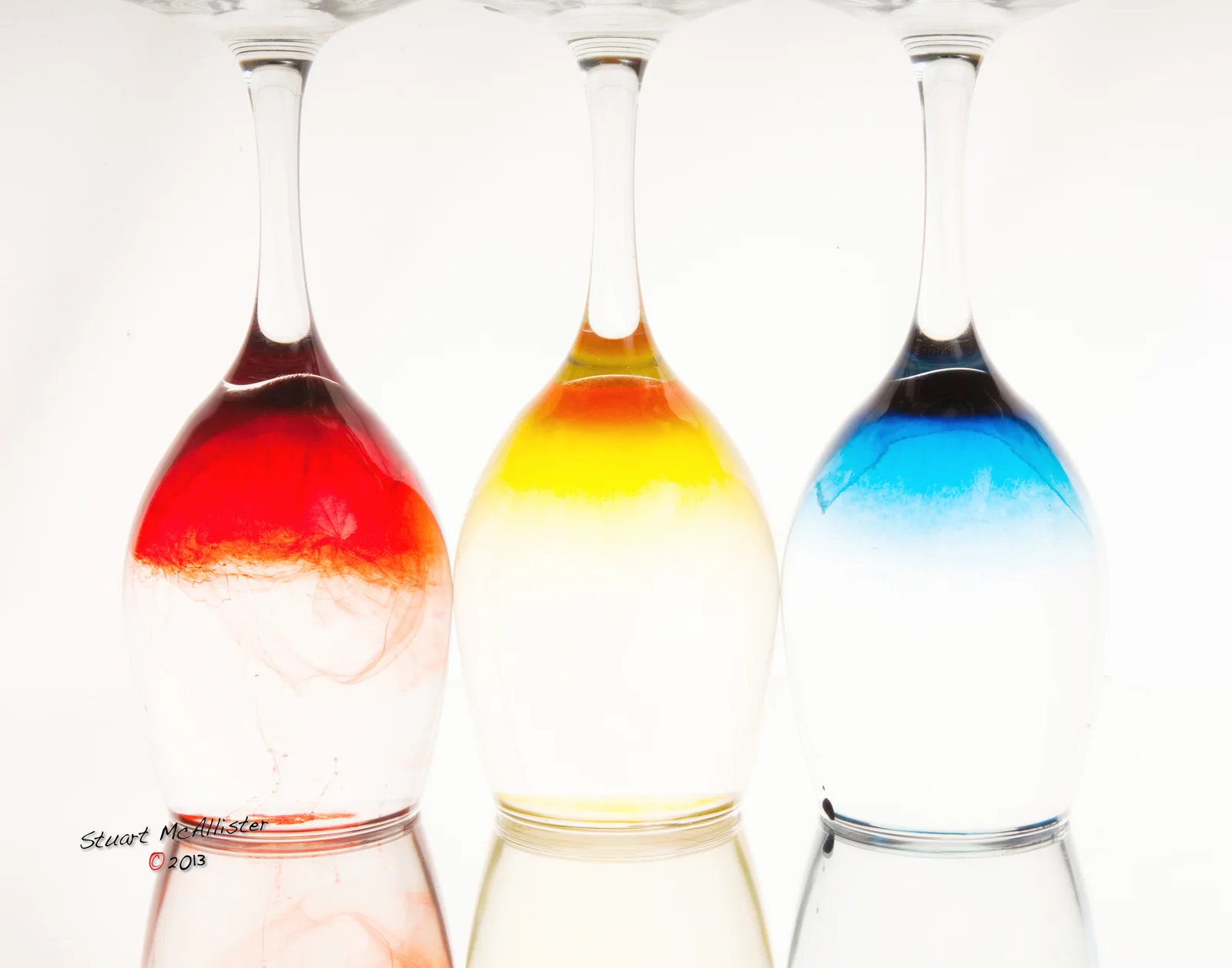 Bands of vivid colour appear to rise through the photographic space.