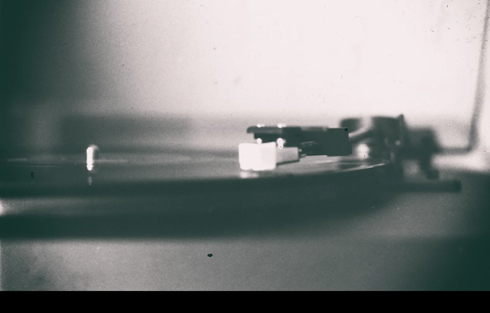 The needle and face of an old instrument preserve traces of repeated use.